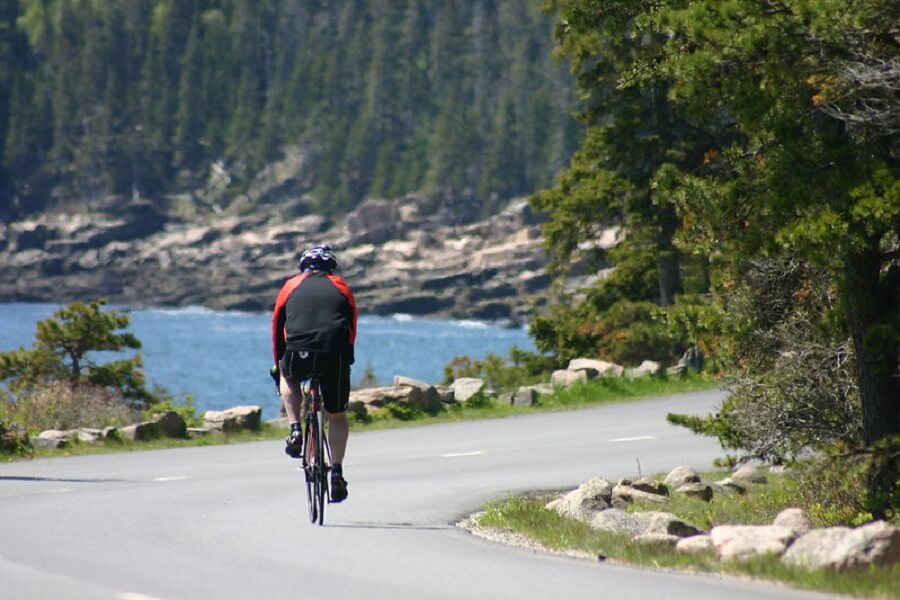 male cyclist bikes the 27-mile Loop Road in Acadia National Park - Flickr image