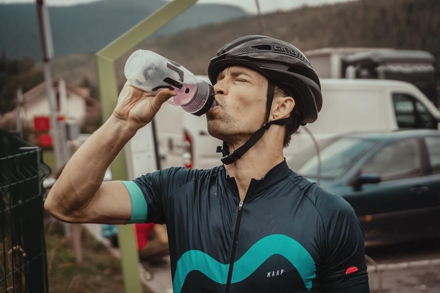 Cyclist Drinking Water From a Bidon