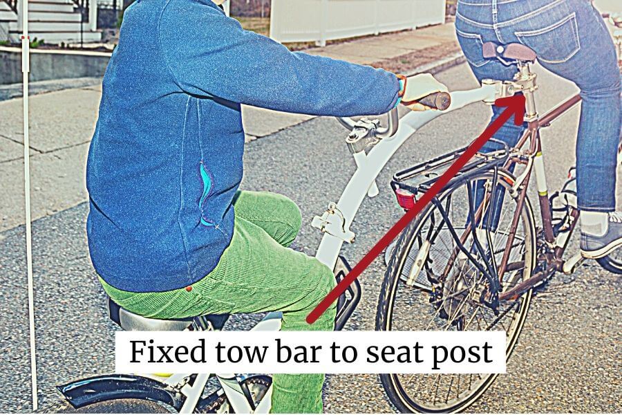 use fixed tow bars to attach kids to the back of your bicycles
