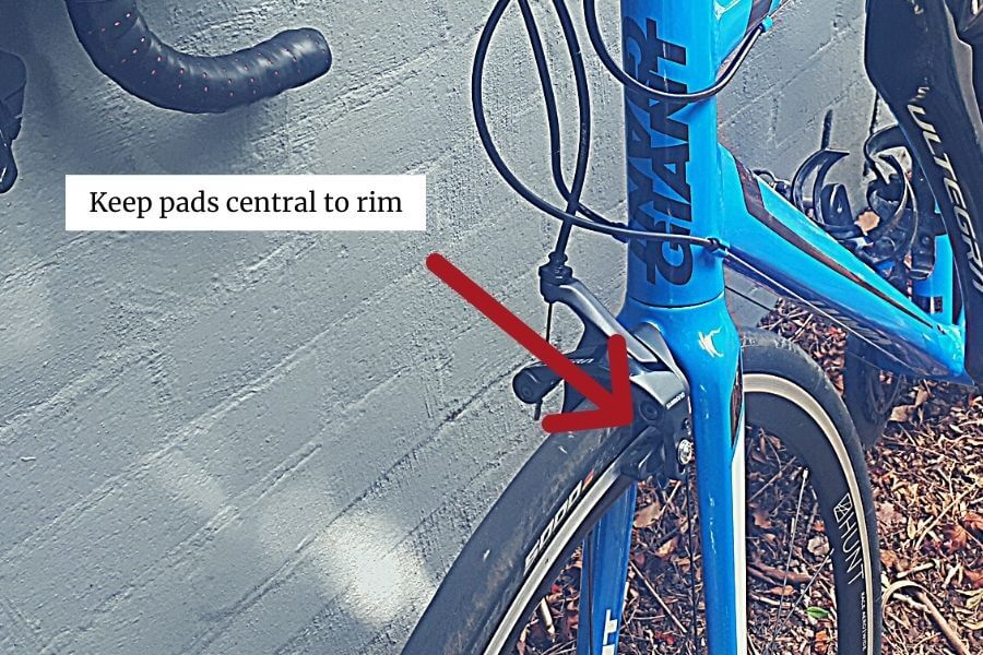 Brake pads central to wheel rim
