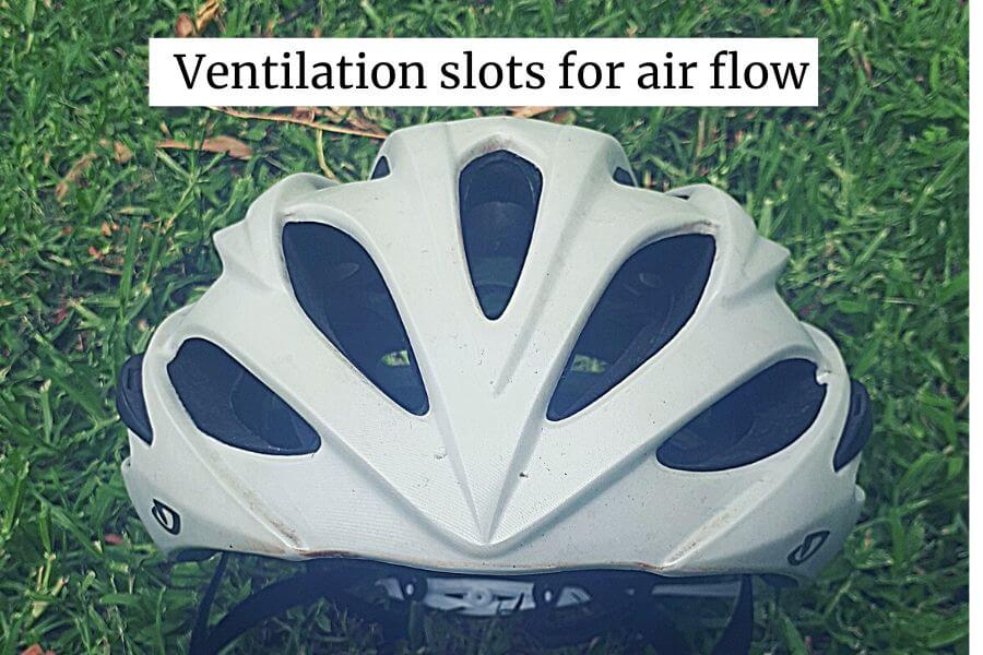 bicycle helmet with ventilation slots for the flow of cooling air