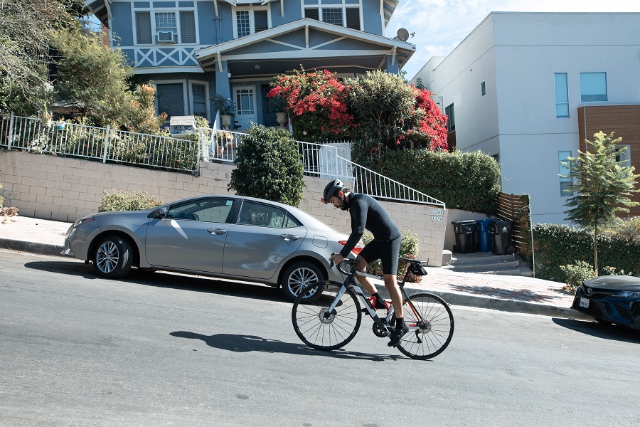 Man cycling up a steep hill