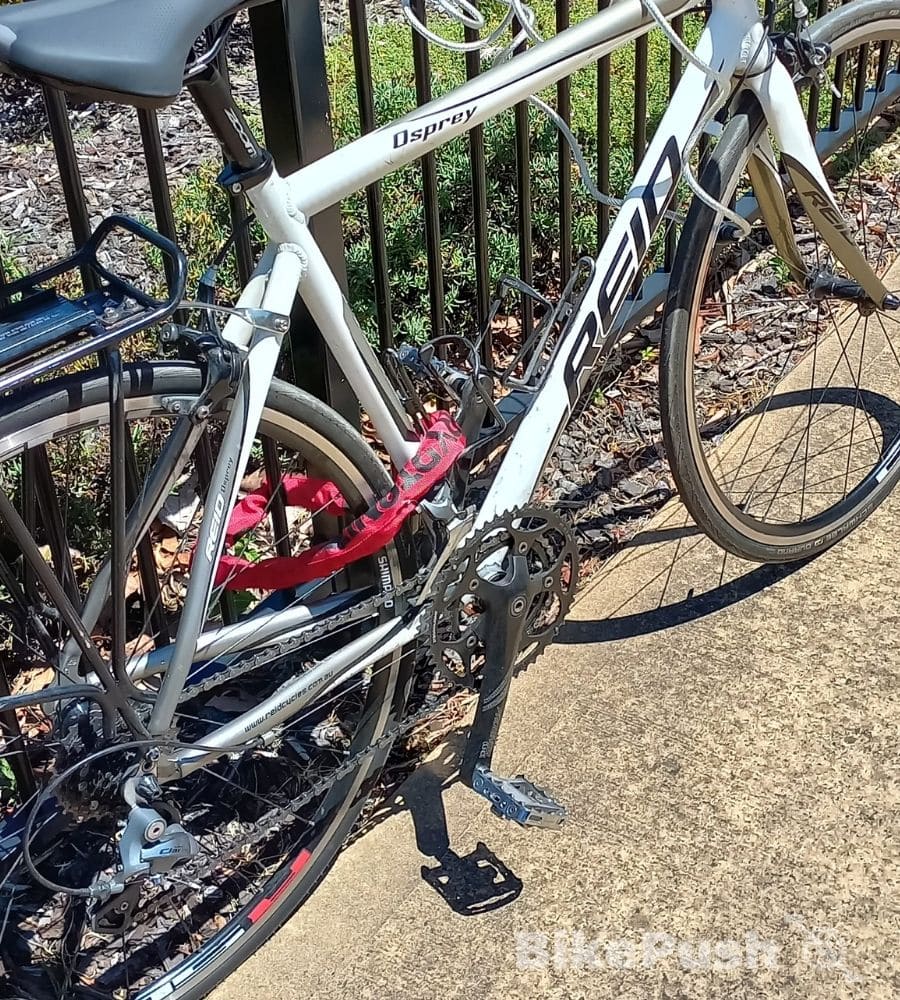 Bicycle locked with a chain lock to iron railings