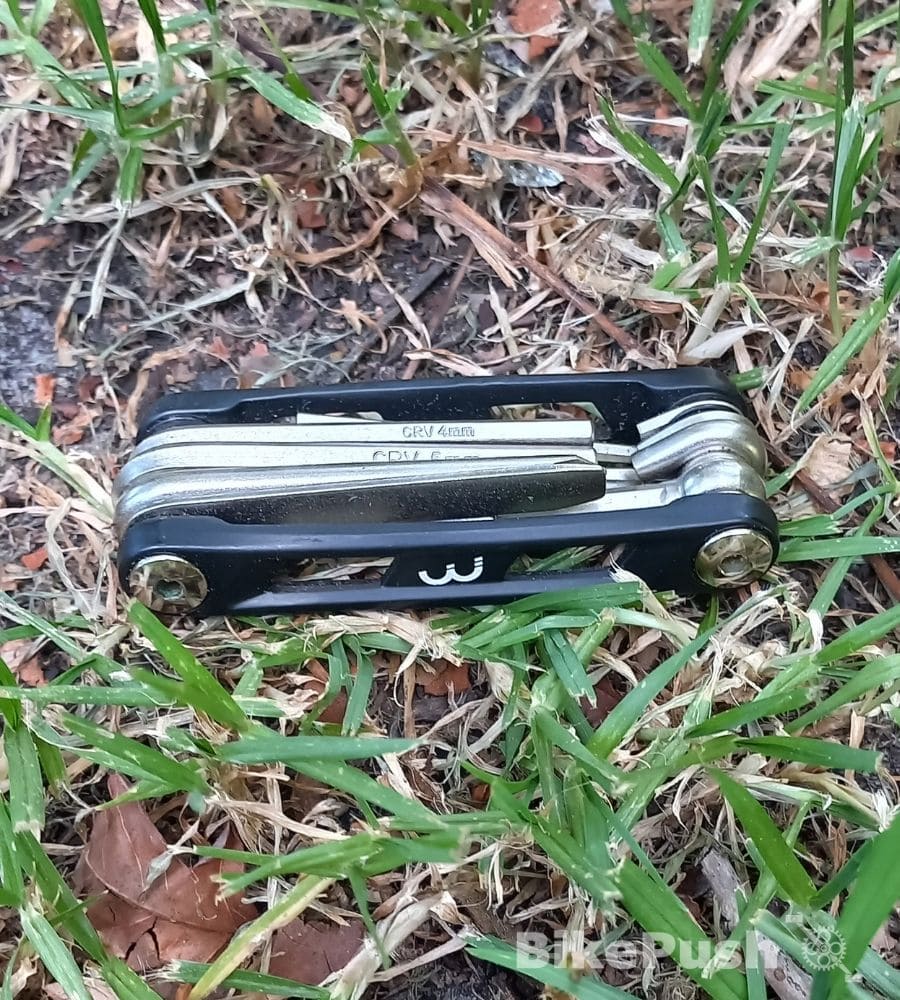 Bicycle multitool for fixing bikes on grass