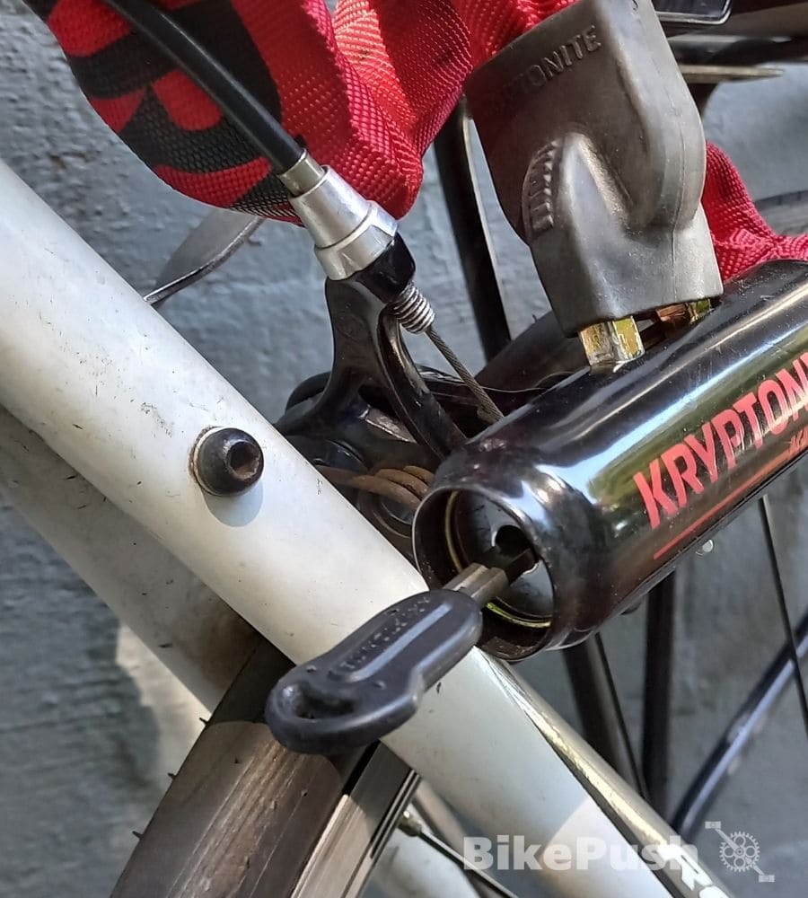 Chain lock wrapped around a bike frame