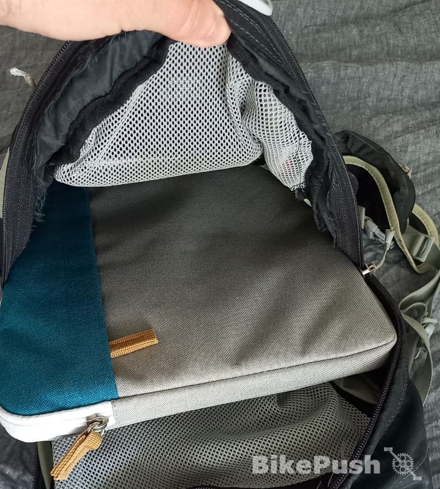 Laptop in protective sleeve inside a cycling backpack