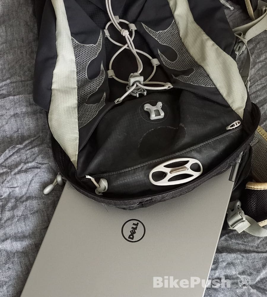 Laptop partially inside a bike commuting backpack