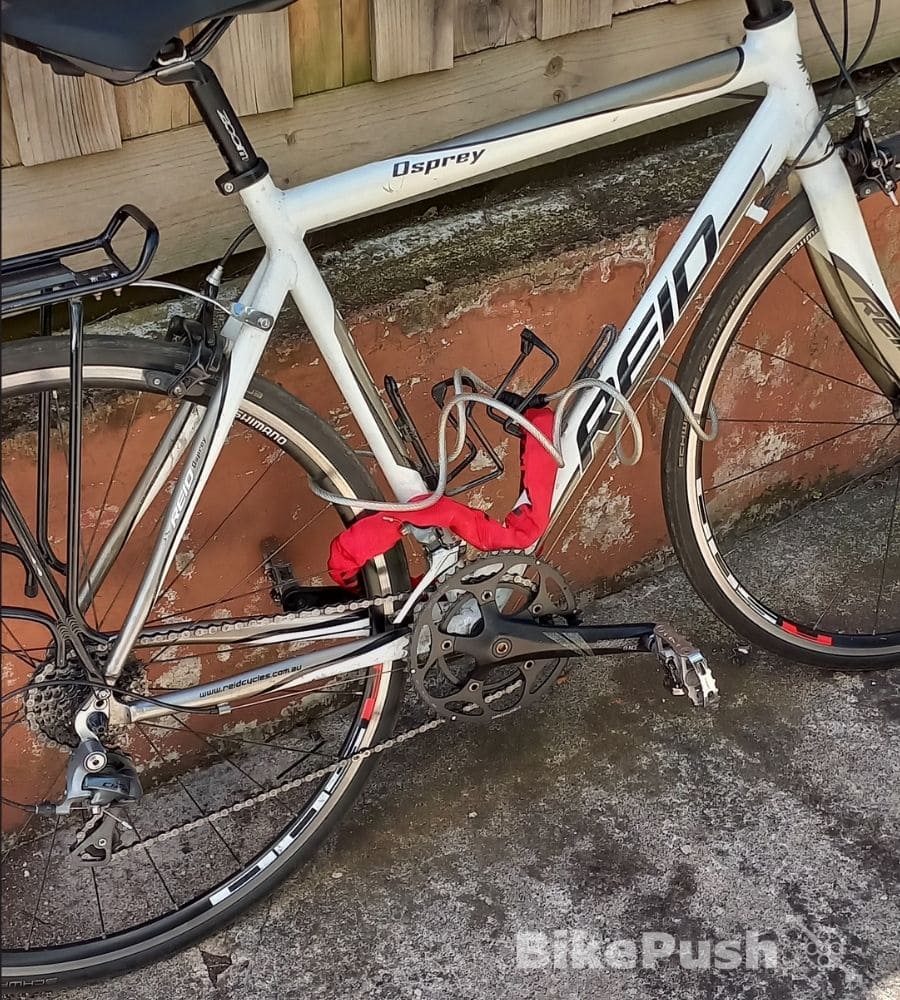 bike locked to itself using wheels