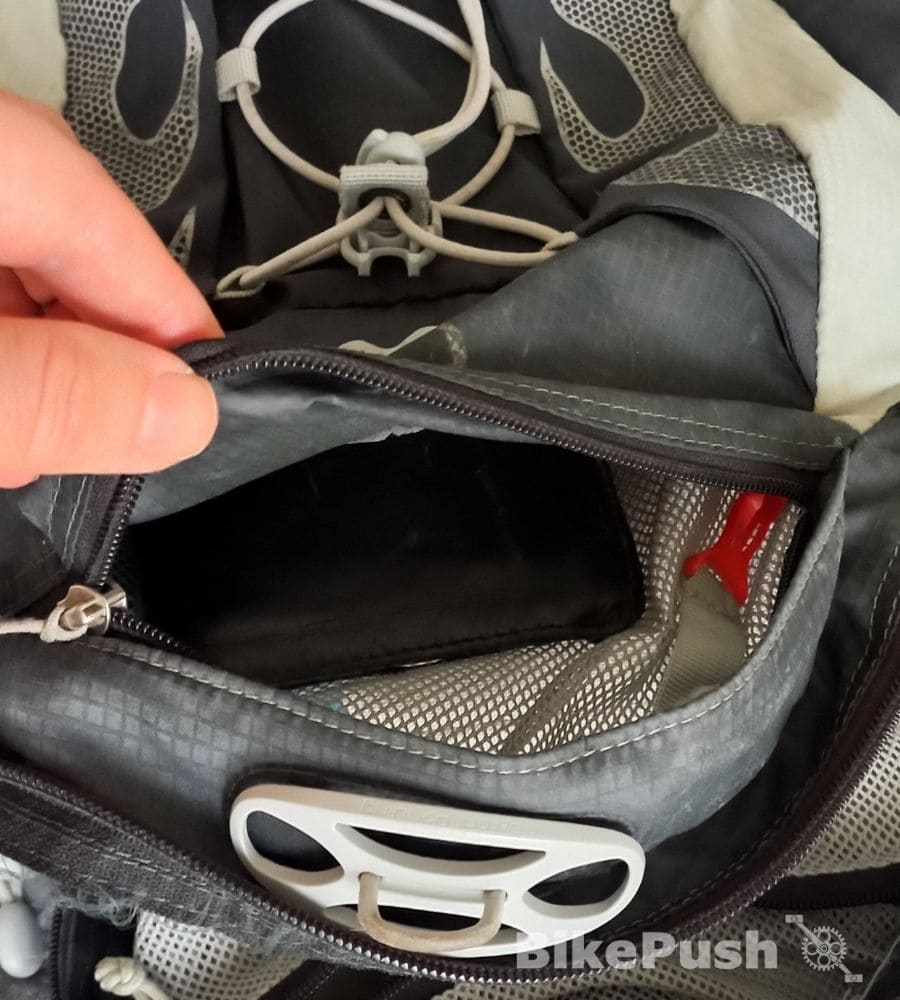 Wallet in a top pocket of a backpack used for cycling