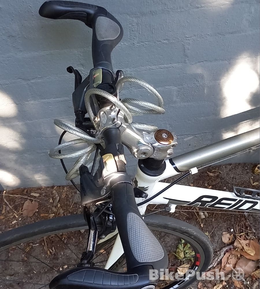 bike cable lock wrapped around handlebars