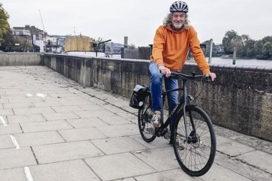 James May riding bicycle with panniers