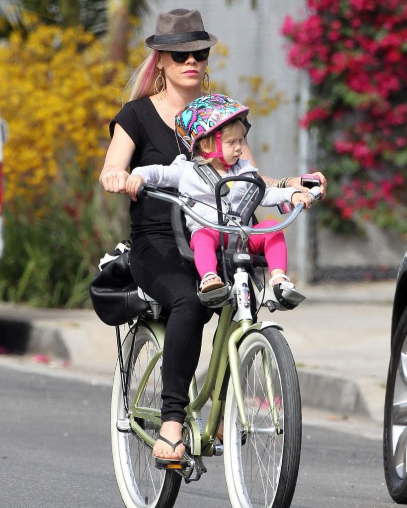 Pink riding bicycle with daughter