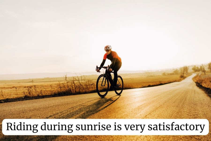 Cyclist enjoying the sunrise