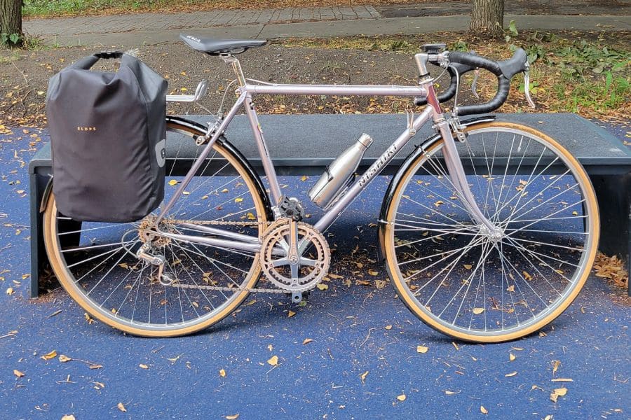 an old bike with a pannier bag on the back 