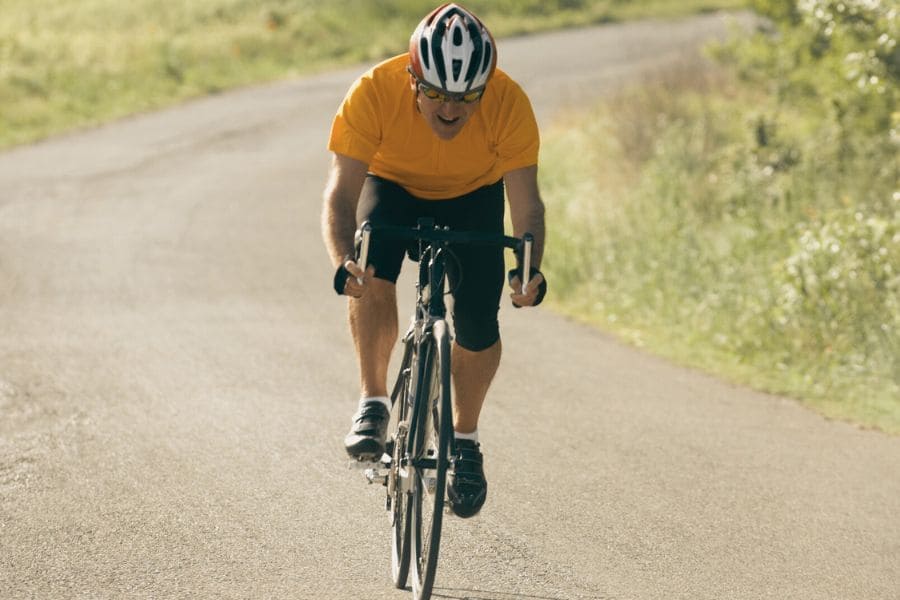 Sprinting up a hill - cyclist