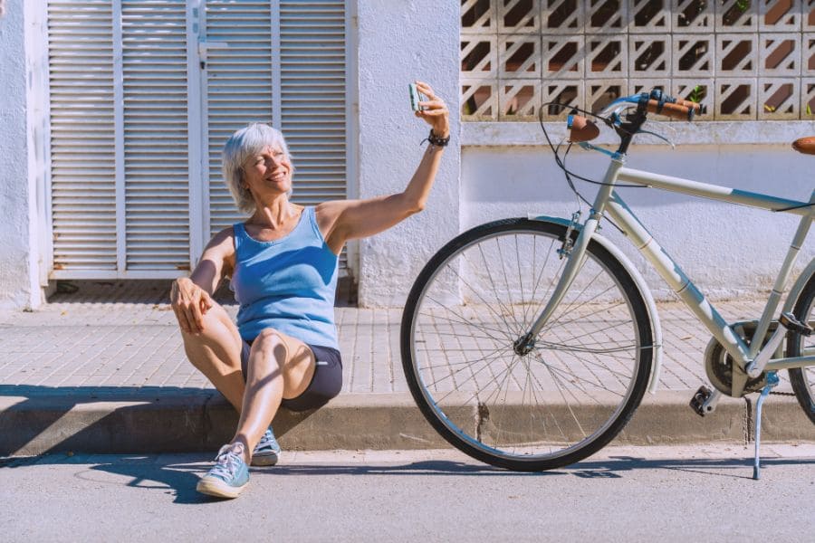 elderly lady cyclist taking a selfie